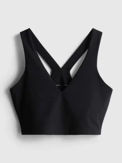 Top corto deportivo con cuello de pico y sujeción suave