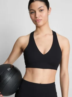 Top corto deportivo con cuello de pico y sujeción suave