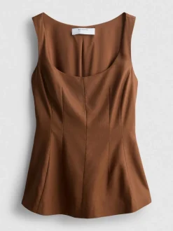 Top formal con péplum en mezcla de lino