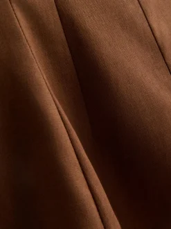 Top formal con péplum en mezcla de lino