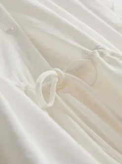Vestido corto a capas con manga corta