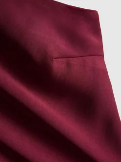 Vestido largo asimétrico con manga acampanada