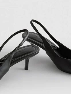 Zapatos de tacón de piel sintética destalonados