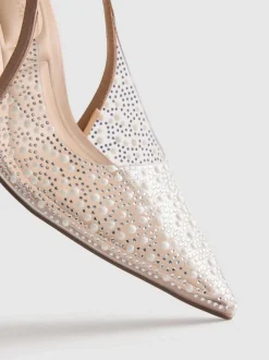 Zapatos de tacón destalonados con tira posterior